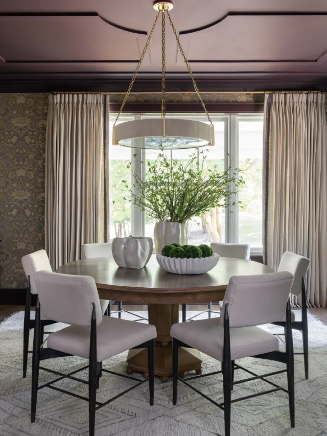 INTRODUCING :: The Dining Room at #ProjectDutchColonialDelight ✨

Our clients are big fans of the color purple, so we chose to make it a defining feature of their dining room design.

To create a bold yet refined statement, we color drenched the ceiling, trim, and pocket doors in their favorite hue while keeping the remaining finishes soft and neutral. A subtly shimmering wallpaper adds warmth and elegance, while the floor-to-ceiling linen draperies soften the room and draw the eye upward, emphasizing the height of the space.

We also layered in texture through the rug, chandelier, and mixed wood finishes to create depth and visual interest throughout the room.

Since the dining room flows directly into the kitchen through the new double pocket doors, we carried the same hue into a custom bar cabinet design to create cohesion between the two spaces.

Fun facts: we found the original French doors in the garage, restored them and installed them back in their proper place. And this is no ordinary dining table - check out the video of us showing our clients how it works on reveal day. 😉

Although we completed a dramatic renovation of this space, architectural constraints and exterior considerations prevented us from relocating the window to center it within the room. In the end, we embraced the asymmetry because it adds character and authenticity to the home. Sometimes those imperfect architectural details are what make a space feel layered, collected, and full of charm rather than overly formal or predictable.

Swipe left to take in all the details, and don’t miss the before photos and video at the end!

Design + Details // @swankbydesign 
Builder // @brianendersconstruction 
Architect // @hkk_architects 
Window Treatments // @decorfabrics.design